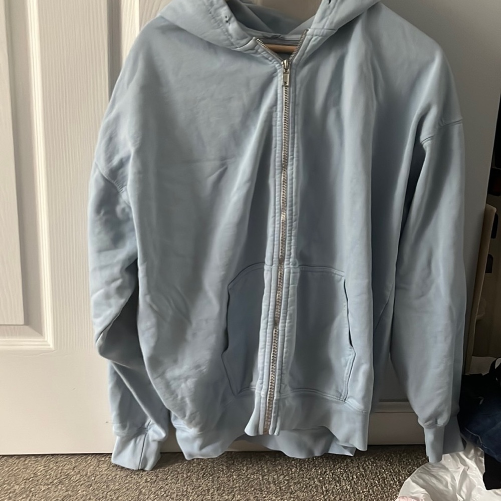 John Galt. zip up, it is more blue in person then in pictures.